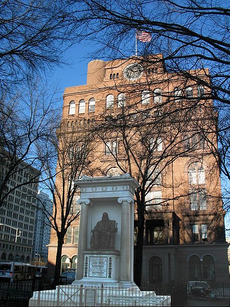Statue of Peter Cooper in front of Cooper Union, in winter Statue of Peter Cooper in front of Cooper Union